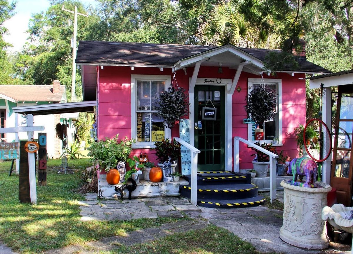 One of the original motor-court cabins at Bayard Antique Village, now a painted vendor cottage