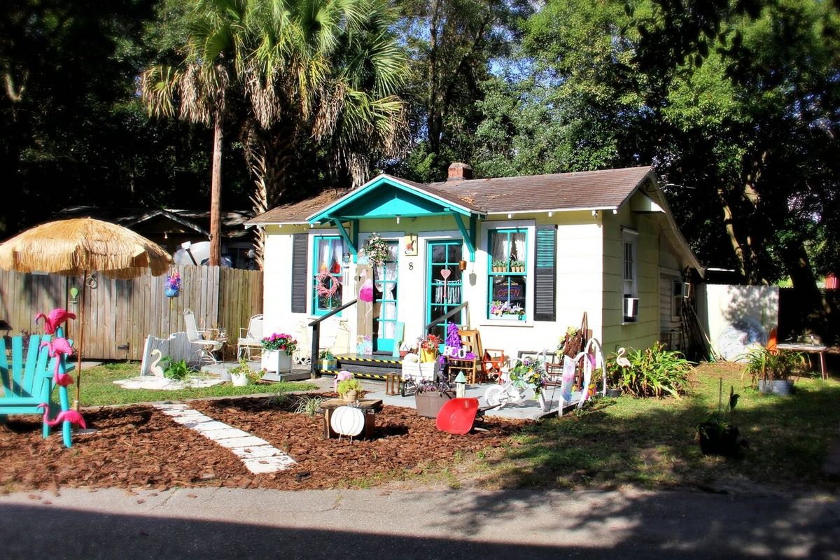 A brightly painted former cabin, now an independent shop at Bayard Antique Village