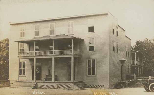 Black and white photograph from 1901 of Wing's, a two-story wood-frame hotel elsewhere in the town of Bayard, Florida, during the town's early depot years